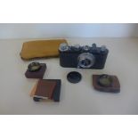 An early Twentieth Century Leica 35mm camera No 105299 with a Leitz Elmar 1.35 F 50mm lens, also a