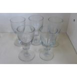 Five 19th century cordial glasses, all approx 11.8cm high, with cylindrical stems and round bases,