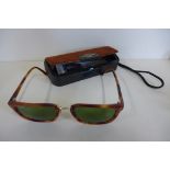 A pair of ray-Ban E W-0868 sunglasses with Bausch and Lomb case