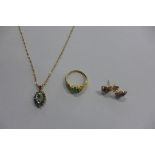 A 9ct gold necklace with diamond and emerald pendant, chain approx 46cm long, and a yellow metal