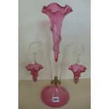 A cranberry glass epergne with two baskets, chip to one basket otherwise good, 46cm tall