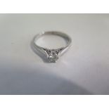 A white metal diamond solitaire ring, approx 0.20ct, ring size N, approx 3.2 grams, diamond