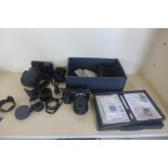 A Sony Nex-7 mirrorless 24.3 mega pixels digital camera with attachments , instructions and a