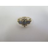 A 9ct ring set with three oval opal type stones with pierced setting, size O, approx 2.1 grams, in