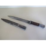 A WWII German bayonet and scabbard, signed J Corts sn 1214 b, blade length 25cm, generally good,