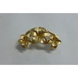 A 14ct gold floral pendant approx 4cm wide, approx 8.7 grams, in good condition