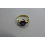 An 18ct gold blue sapphire and diamond ring, size L, approx 2.6 grams, some usage marks