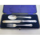A silver christening set in original presentation box, approx 2.4 troy oz overall, in good condition