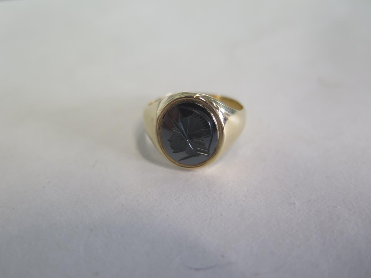 A 9ct yellow gold hematite signet ring, approx 6.3 grams, ring size U, generally good condition