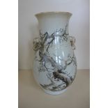 An early 20th century oriental vase with elephant head handles, and later script, 30cm tall, no