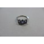 A 9ct white gold three stone dress ring, size O, approx 2.2 grams