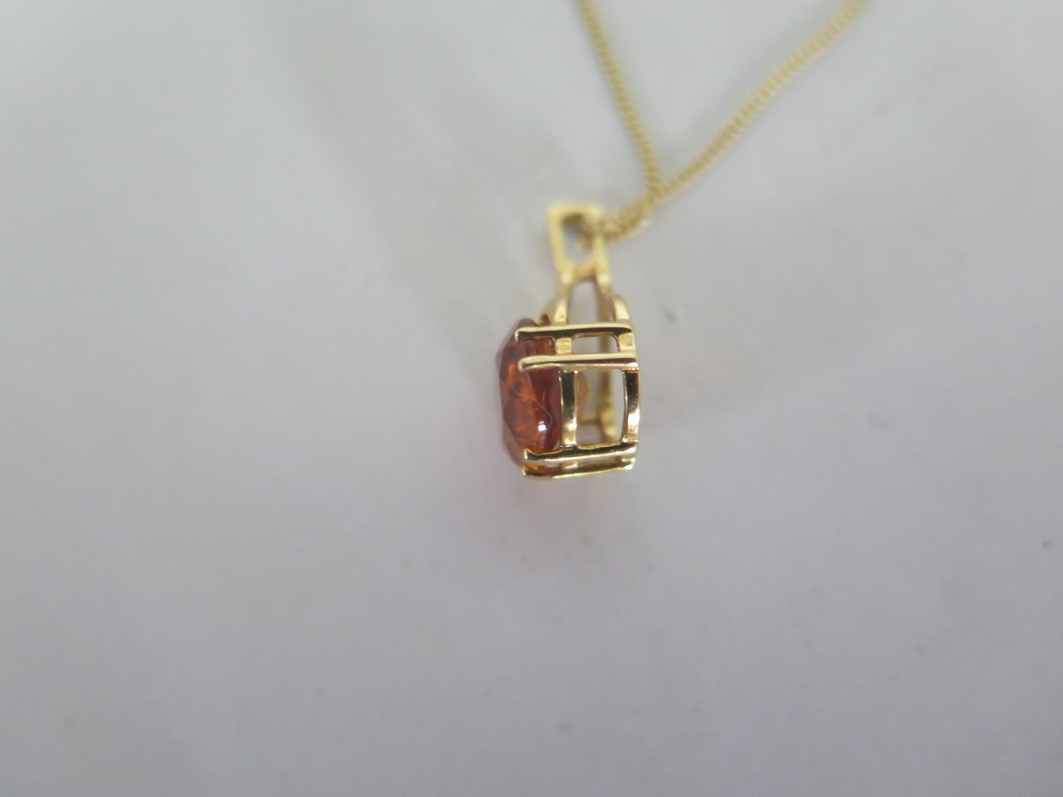 An 18ct yellow gold topaz pendant on an 18ct yellow gold 45cm chain, stone approx 9x7mm, in good - Image 3 of 3