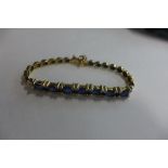 A 14ct gold blue sapphire and diamond bracelet, approx 18cm long, approx 16.2 grams, overall in good