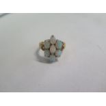 A 9ct yellow gold opal seven stone ring, size N, approx 4.2 grams, in good condition