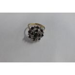 A 9ct sapphire and diamond cluster ring, size V, approx 5 grams