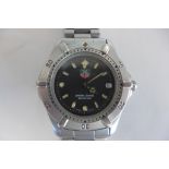 A Tag Heuer Professional gents mid range watch with steel case and bracelet, calendar, box and