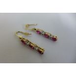 A pair of 9ct ruby and diamond drop earrings, approx 2.3 grams, in good condition