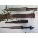 Two African daggers in leather scabbards, 42cm and 32cm long, some pitting to blades but generally