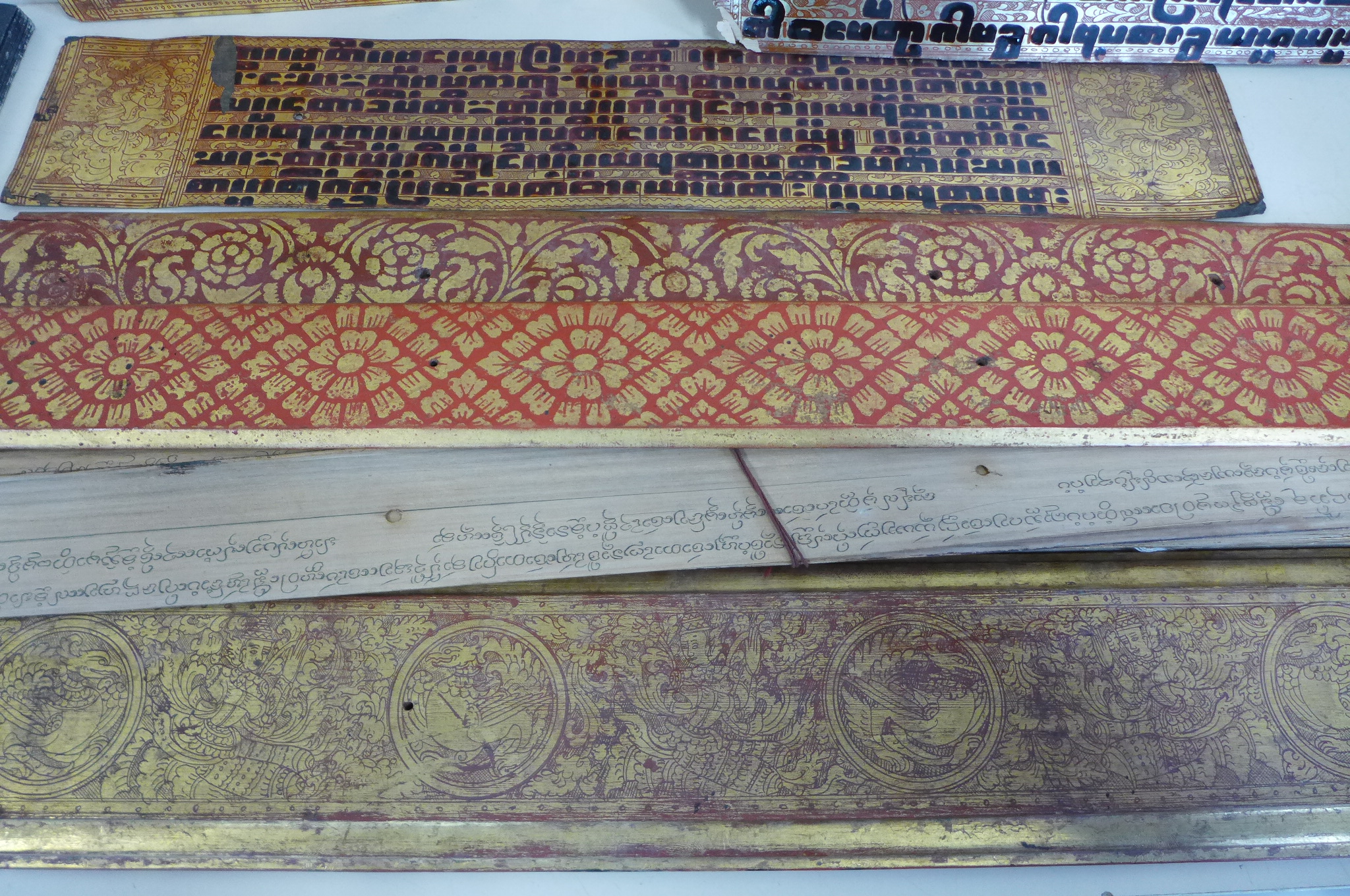 A collection of Tibetan prayer scripts, including a carved block - 15cm long - Image 6 of 6