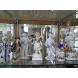 A Staffordshire figurine of a flower girl, approx 18cm H, together with a Nid Nod judge figurine and