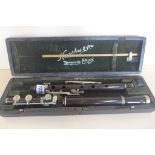 A rosewood flute by Hawks London circa 1890 with a box