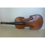 An 18th/19th century violin with a two piece 14 1/4 inch back, in need of restoration