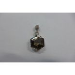 A 9ct white gold smokey quartz pendant - 35mm tall, approx 4.8 grams, in good condition