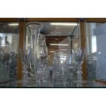 A collection of seven pieces of glass wares including a pair of wine glasses and a decanter with