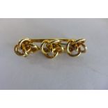 A gold brooch, no hallmark, but tests to approx 18ct, approx 9 grams