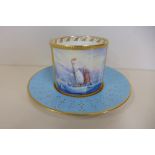 A Stefan Nowacki Lynton porcelain company Derby coffee can and saucer, finely decorated with a