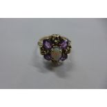 A 9ct gold opal and amethyst dress ring, size Q, 3.8 grams