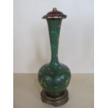 A Chinese early 20th century green cloisonne lamp base on a gilt metal stand, height 40cm, small