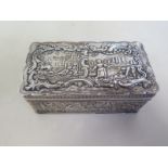 A Dutch silver box, extensively decorated with embossed scenes, approx 10.2cm x 4.2cm x 6cm - approx