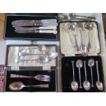 Eight pieces of silver flatware, and a cased set of six spoons, knife and fork and two silver bladed