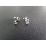 A pair of 9ct gold diamond stud earrings