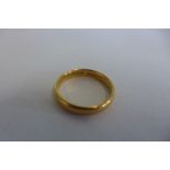 A 22ct yellow gold band ring, size N, approx 4.5 grams, general usage marks