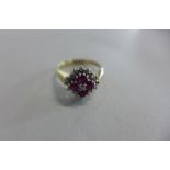 A 9ct yellow gold ruby and diamond cluster ring, size I, approx 2.2 grams, generally good condition