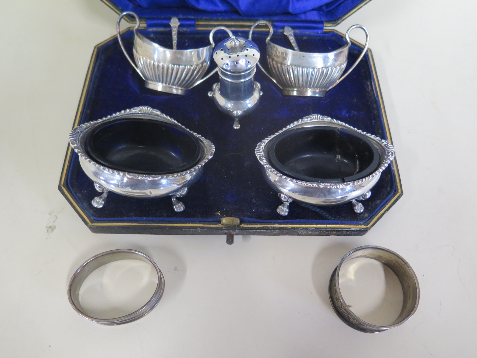 Nine pieces of silver, approx 6.9 troy oz, two pairs of salts, napkin rings and pepper pot