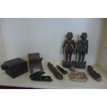 A collection of ten Eastern carvings of figures, a box, stand panel and scales, pair of figures,