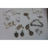 An assortment of silver necklaces and rings, together with four silver fobs, overall approx 2.6 troy