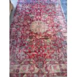 A hand knotted woollen Nahavand rug, approx 232cm x 148cm - in good condition