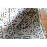 A hand knotted woollen Kashan rug - 300cm x 192cm