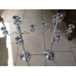 A pair of white metal four branch candelabra, approx 101cm high, in good condition