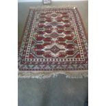 A hand knotted Eastern rug - 255cm x 173cm - in good condition