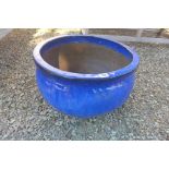 A large blue glaze pot, 35cm tall, 54cm wide, chip to rim