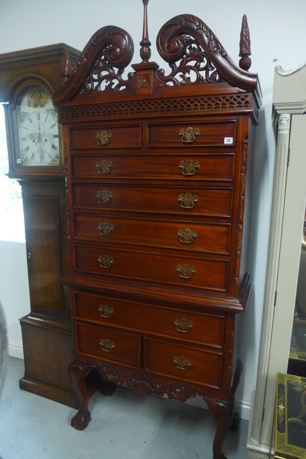 An American style mahogany chest on stand with an arrangement of nine drawers, 211cm tall x 90cm