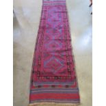 A hand knotted woollen Meshwani runner, approx 242cm x 61cm in good condition