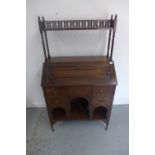A late Victorian mahogany bureau with an upstand above a fall front and five small drawers, 140cm
