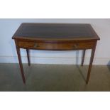 A mahogany bow fronted desk with single drawer and leather inset top