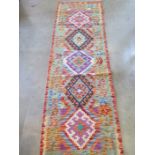 A hand knotted vegetable dye wool Chobi Kelim runner - approx 190cm x 60cm - in good condition